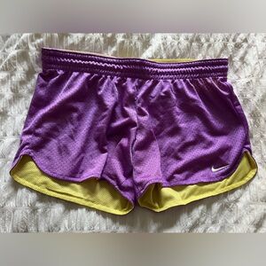 Yellow and purple Nike athletic shorts